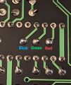 The underside of the NTSC board has these solder pads for RGB output.